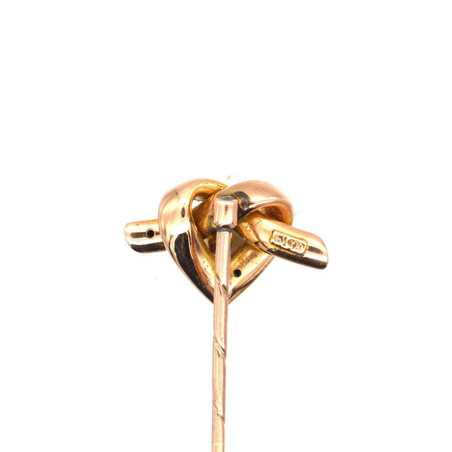 Late Victorian 15ct gold heart motif tie pin featuring a lover's knot and a natural pearl, dating from 1880-1900.