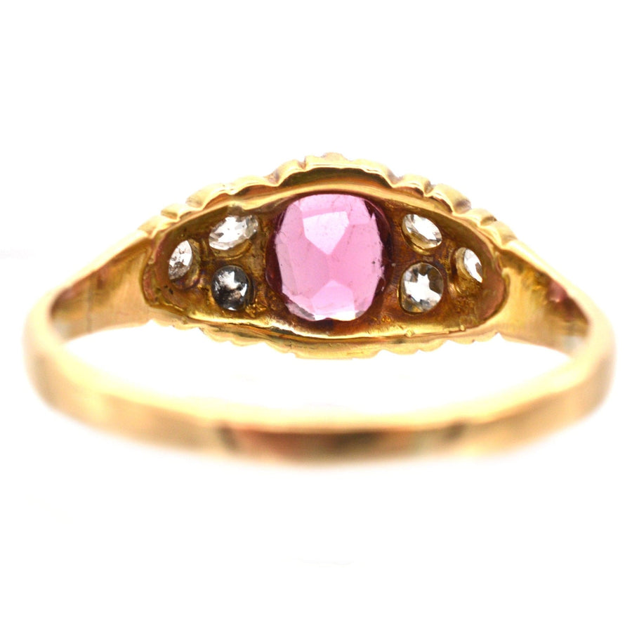 18ct gold ring featuring a pink tourmaline center stone and old-mine diamonds, crafted circa 1890-1900.