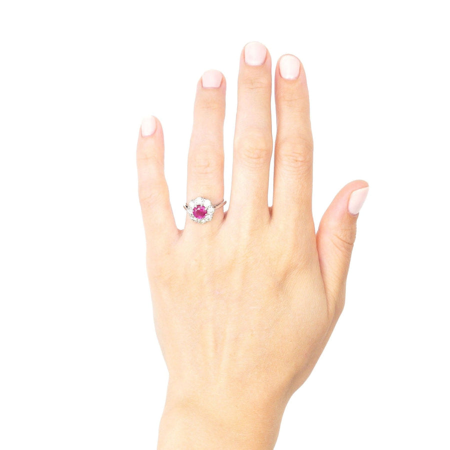 Mid 20th century platinum ring featuring 1.7 carat Burma ruby and diamond cluster, modeled on a hand.