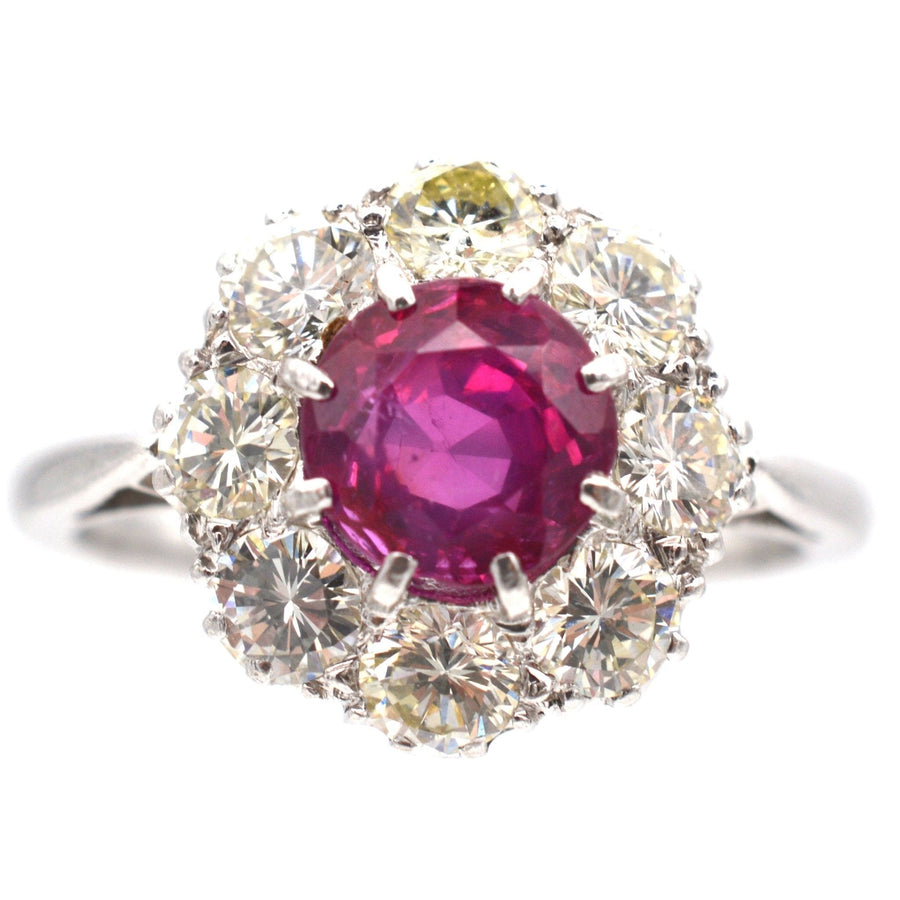 Mid 20th century platinum ring featuring 1.7 carat Burma ruby surrounded by eight diamonds.