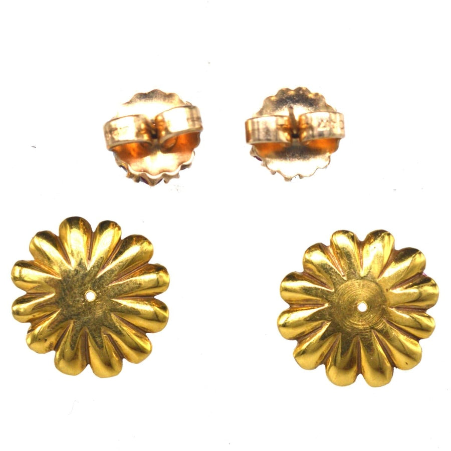 Mid Century gold flower petal jackets for ruby and diamond cluster earrings, showcasing elegant vintage jewelry.