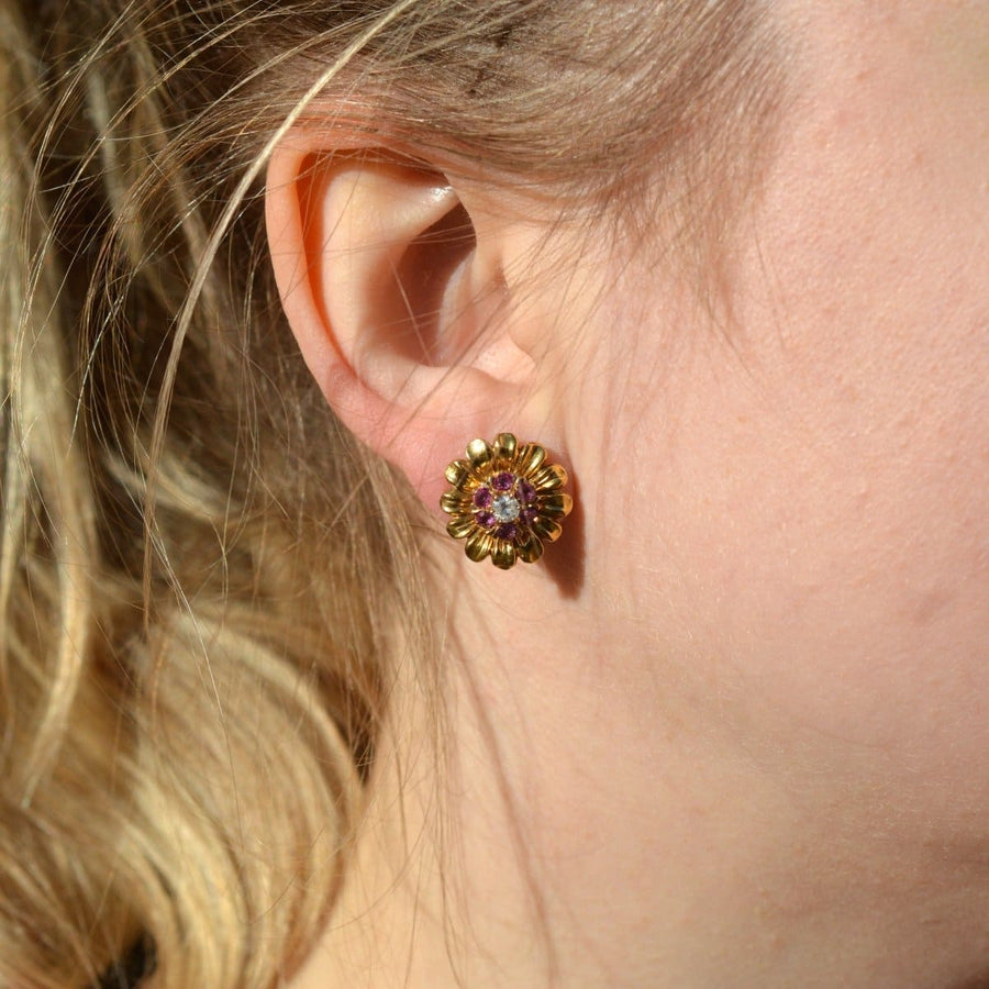 Mid Century 14ct gold ruby and diamond cluster earring with gold flower petal jacket worn on the ear.