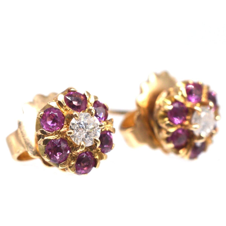 Mid Century 14ct gold earrings featuring ruby and diamond clusters with detachable gold flower petal jackets.