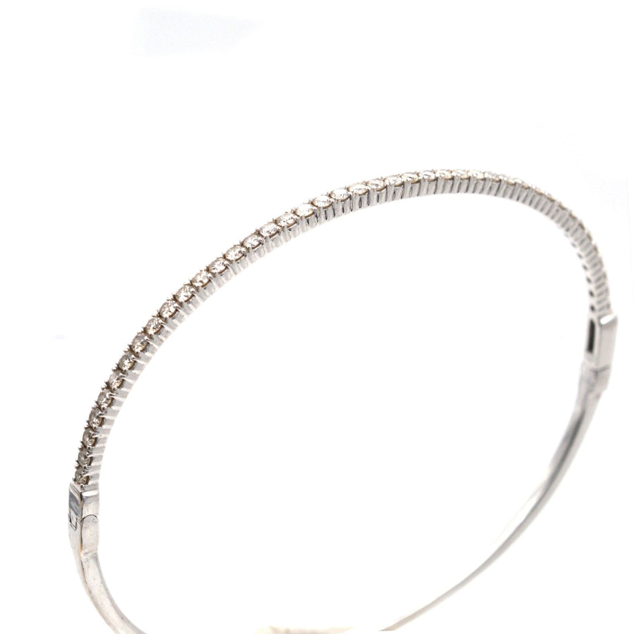 Modern 18ct white gold diamond bangle featuring 40 brilliant cut diamonds, perfect for gifting and stacking.