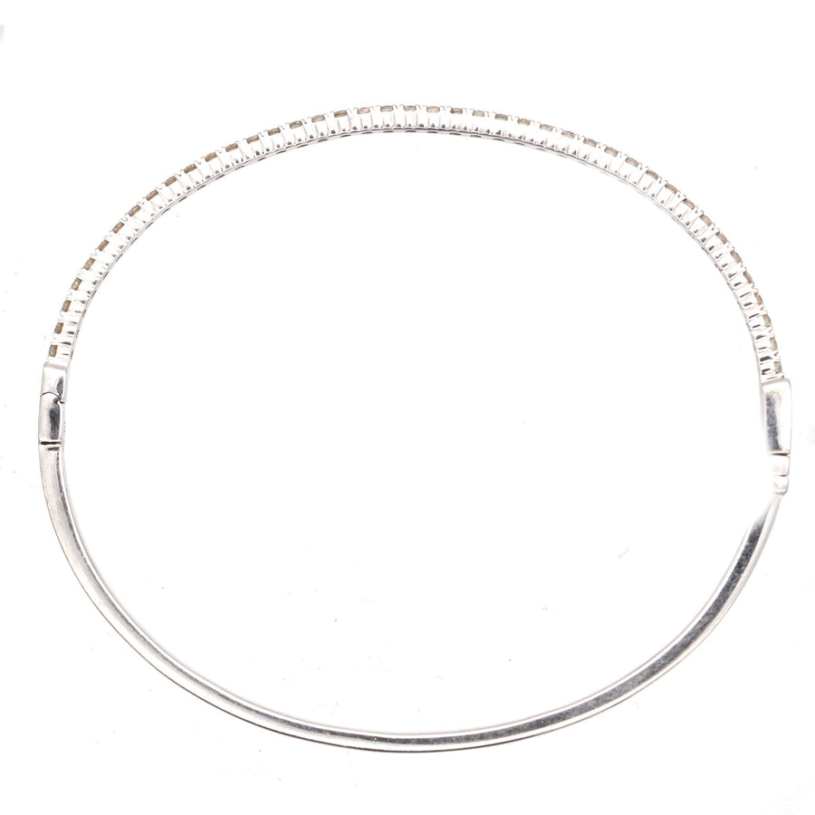 Modern 18ct white gold diamond bangle featuring 40 brilliant cut diamonds, perfect for gifts and stacking.