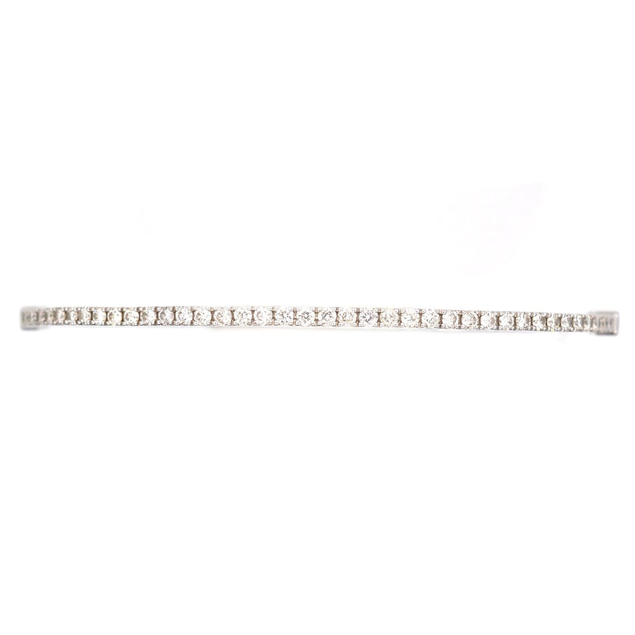 Modern 18ct white gold diamond bangle featuring 40 brilliant cut diamonds, perfect for gifting or stacking.