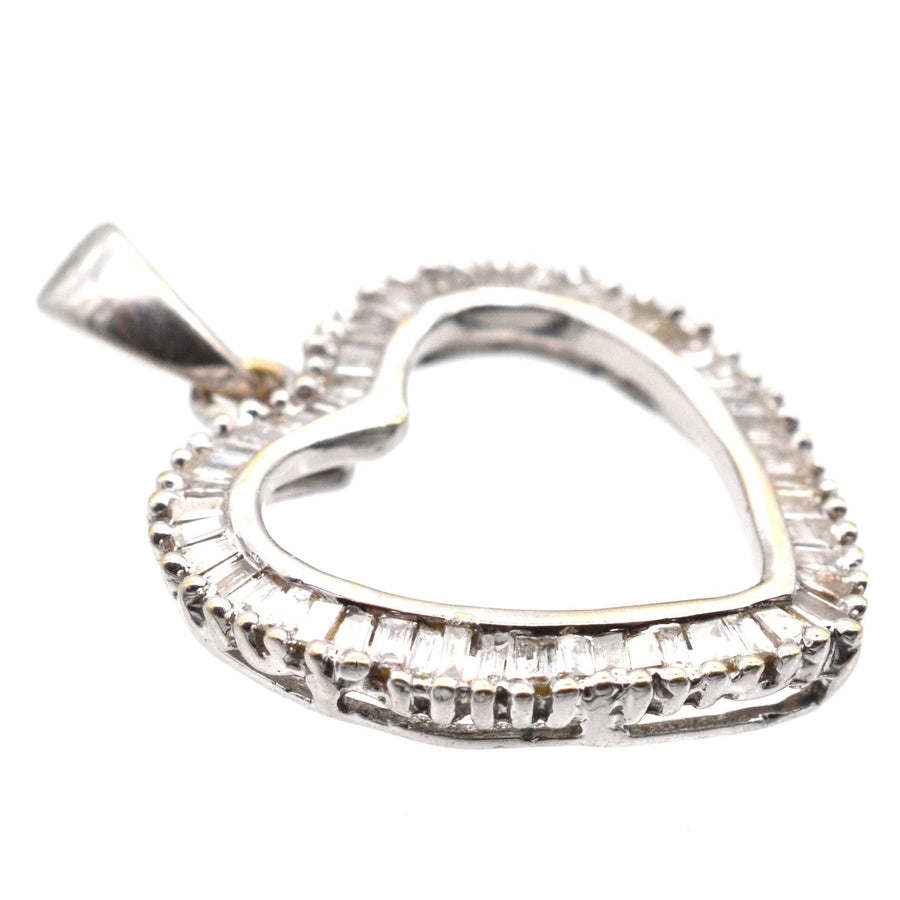 Modern 18ct white gold heart-shaped diamond pendant, featuring half a carat of stunning diamonds, perfect for Valentine's Day.