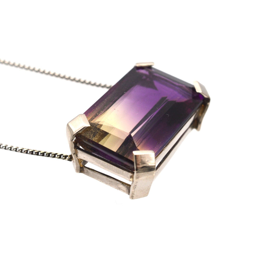 Modern 9ct white gold necklace featuring a stunning 28 carat bi-colour ametrine gemstone.