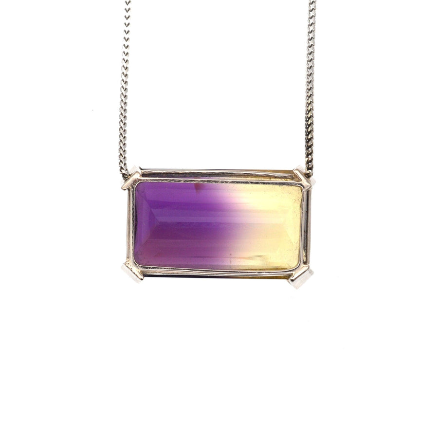 Modern 9ct white gold necklace featuring a stunning 28 carat bi-colour ametrine with purple and yellow hues.