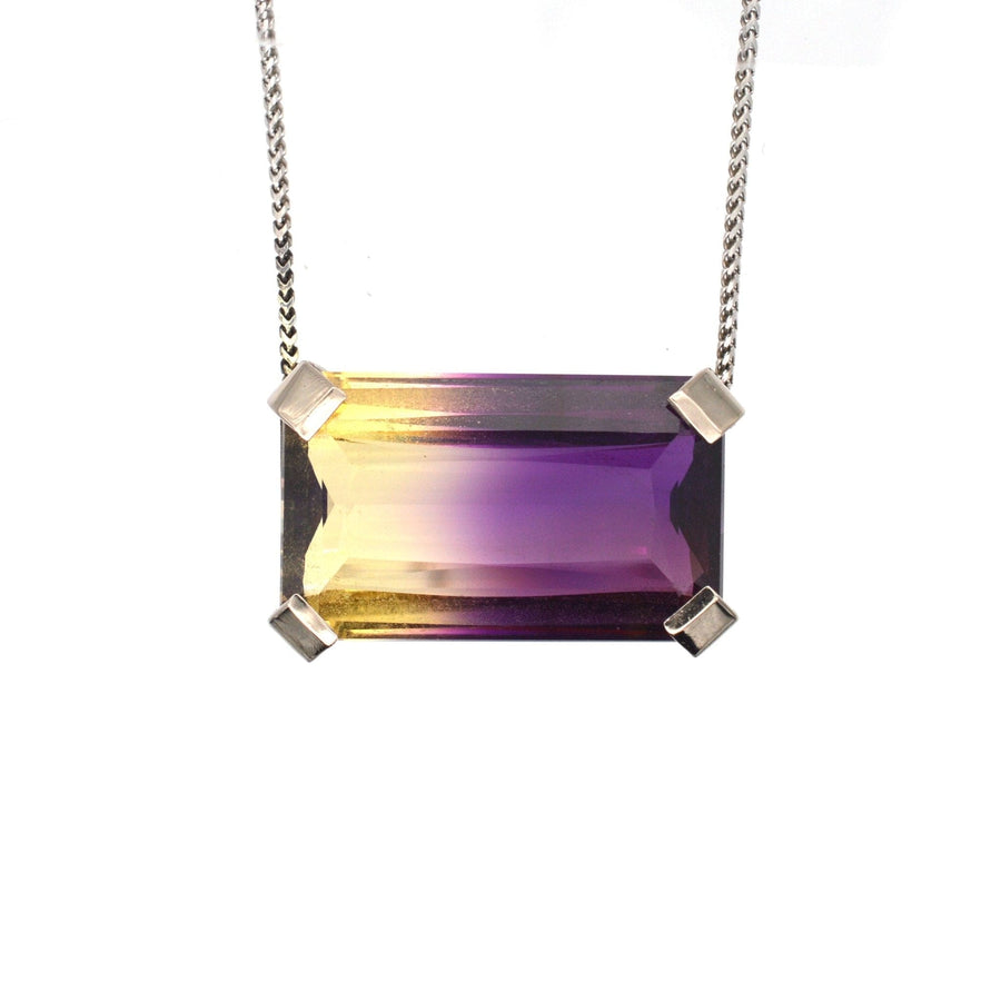 Modern 9ct white gold necklace featuring a stunning 28ct bi-colour ametrine with purple and orange hues.