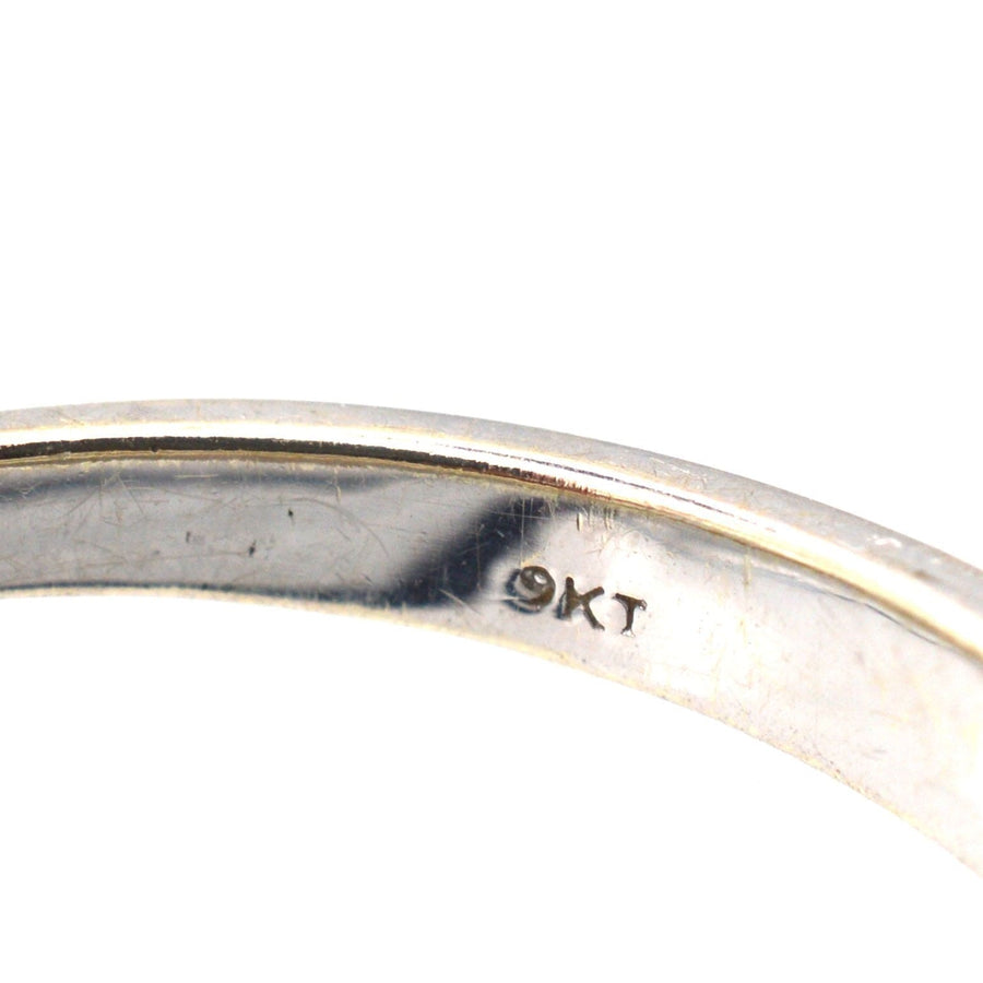 Close-up of a 9ct white gold band showing the hallmark, ideal for a diamond half eternity ring.