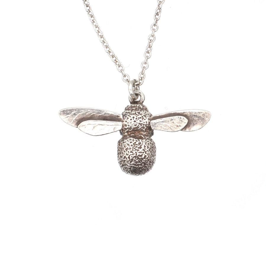 Alex Monroe silver bumble bee pendant necklace on chain, showcasing intricate detailing of wings and body.