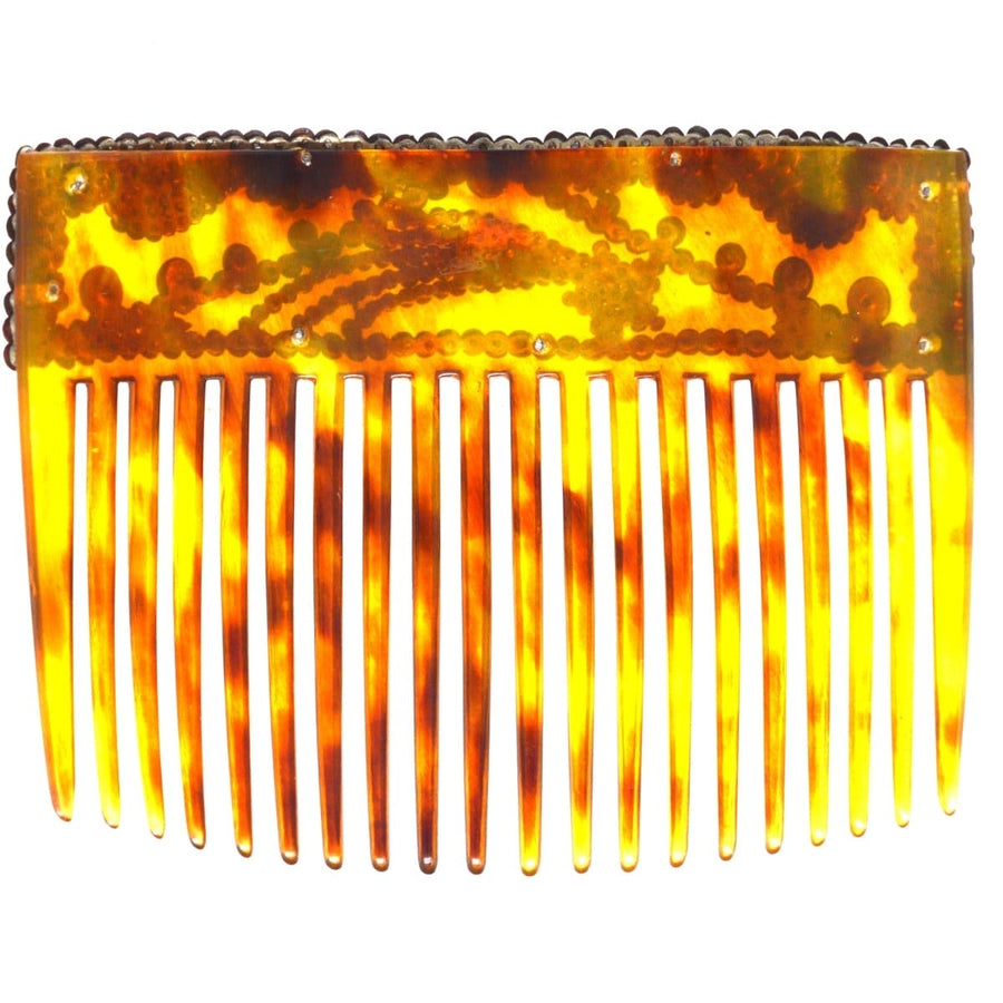 Regency tortoiseshell hair comb with cut steel details, featuring a vintage design and ornate shooting star motif.