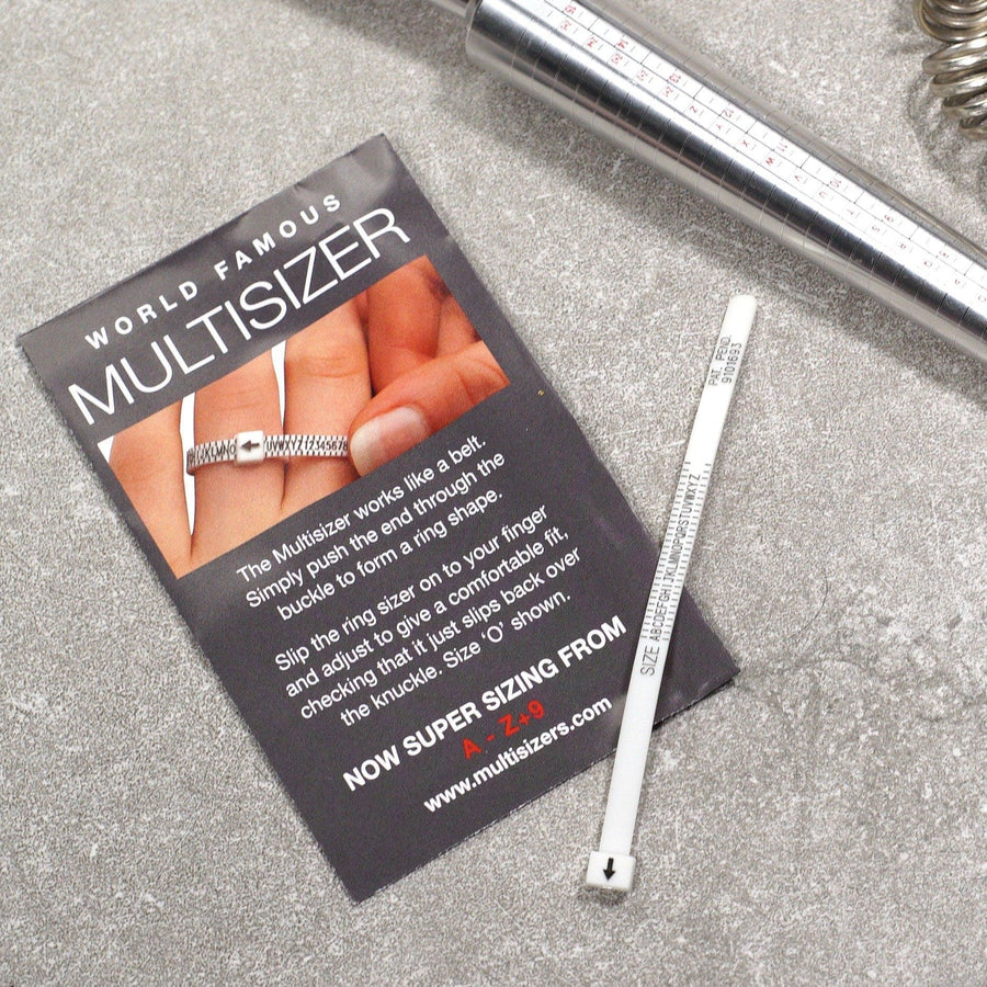 Ring size measurer and card showing how to use a multisizer for accurate finger sizing.