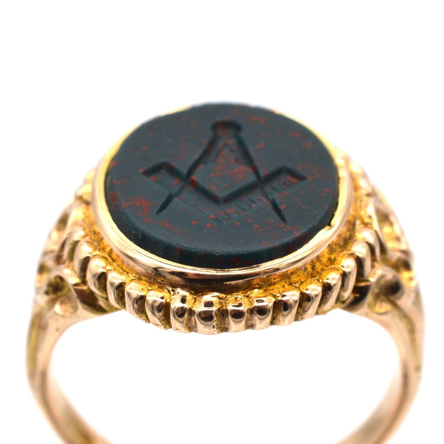 Victorian 15ct gold Masonic signet ring featuring an engraved bloodstone with Square and Compasses symbol.