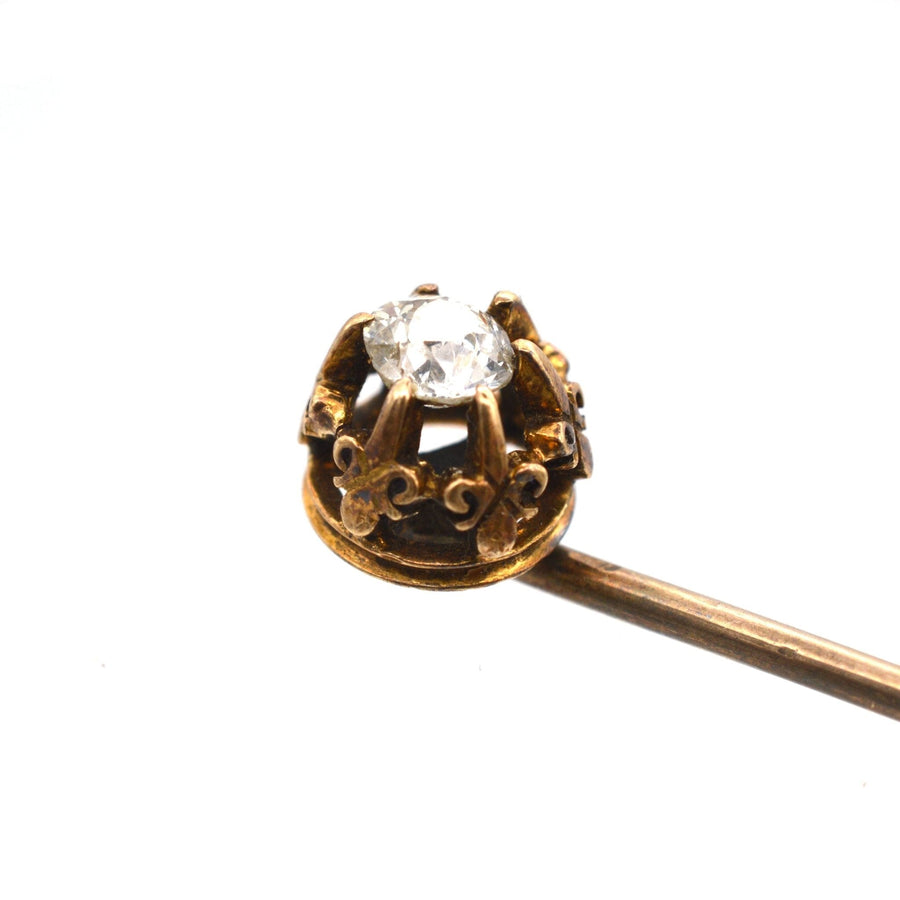 Victorian gold tie pin with old mine cut diamond and fleur-de-lis motifs, circa 1880, elegant accessory.