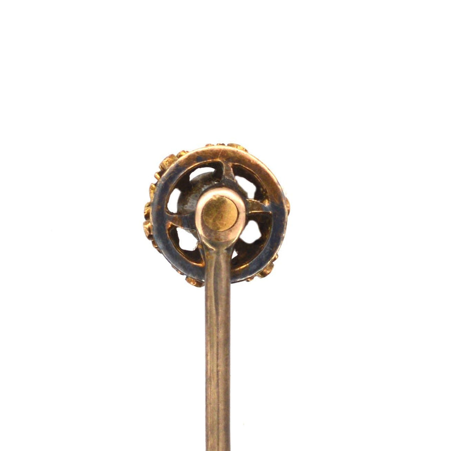 Victorian 15ct gold tie pin featuring a large old mine cut diamond and intricate fleur-de-lis motif setting.