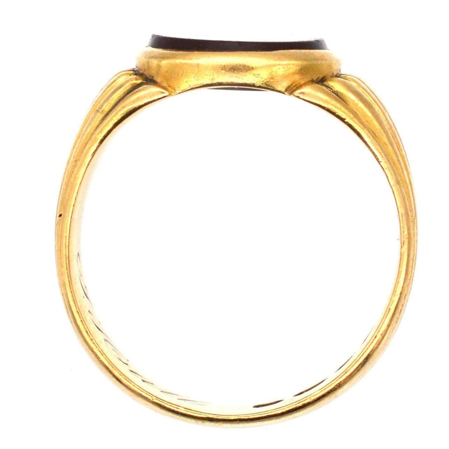 Victorian 18ct gold signet ring with carnelian, featuring elegant incised grooves, crafted in 1888 in London.