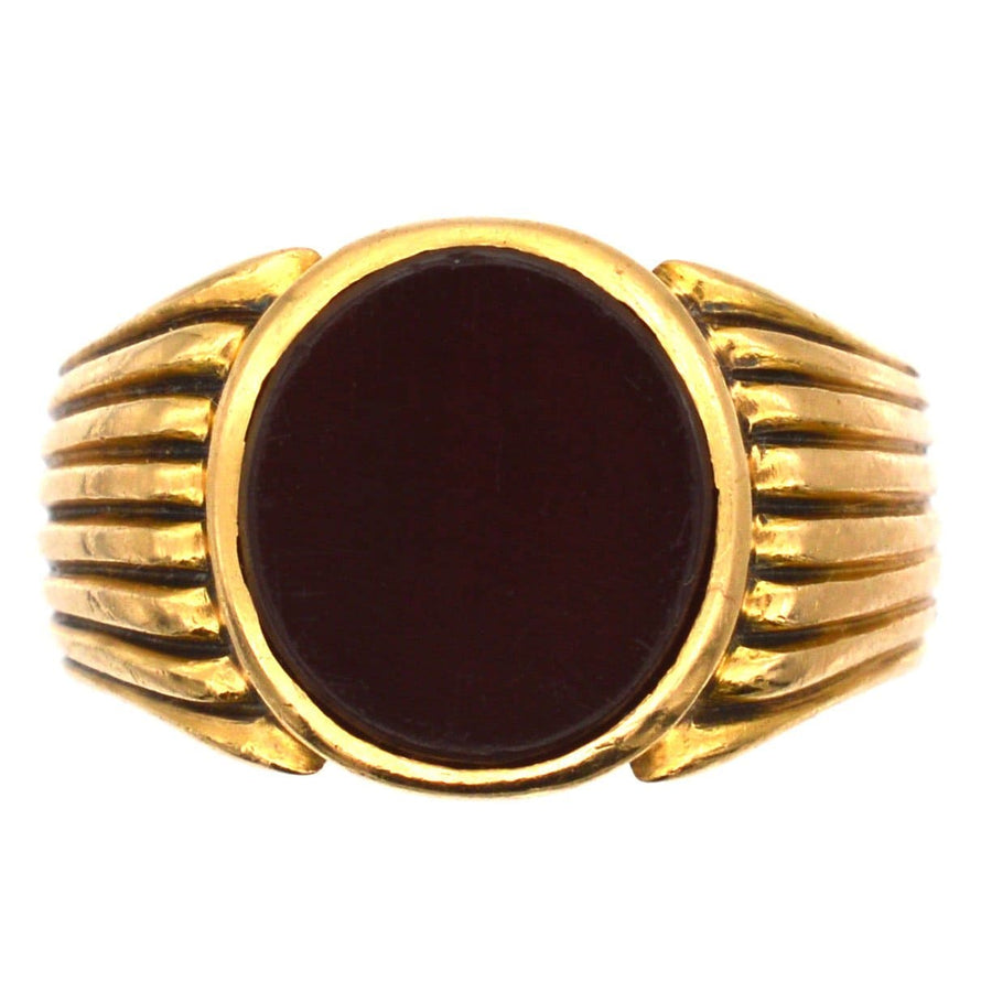 Victorian 18ct gold signet ring featuring a deep carnelian stone, crafted in London in 1888.