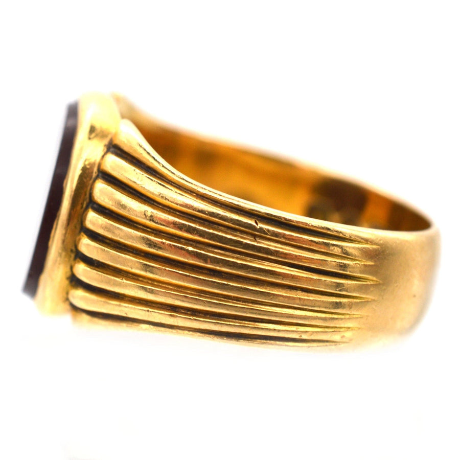 Victorian 18ct gold signet ring with carved grooves and carnelian stone, made in London in 1888.
