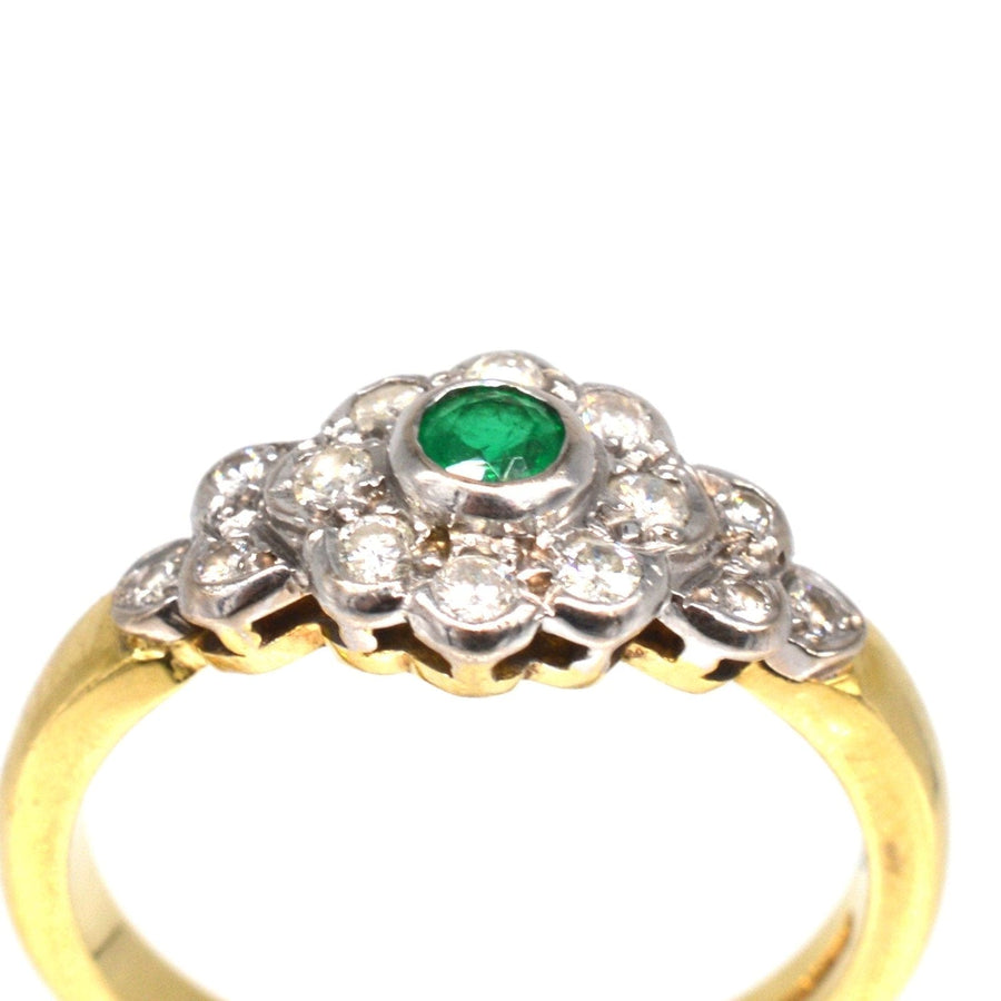 Vintage 18ct gold emerald and diamond cluster ring with sparkling diamond shoulders.
