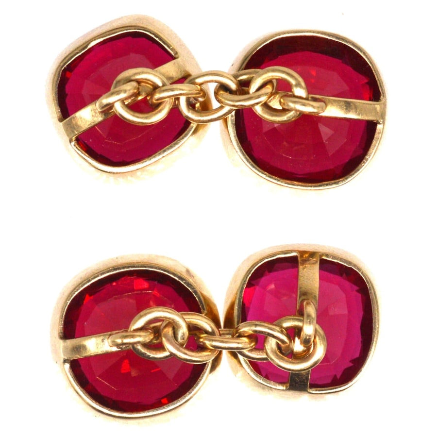 1940s 9ct gold cufflinks featuring vibrant red paste stones, stylishly crafted for a unique accessory.