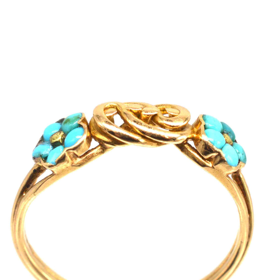 Knotenring aus 18-karätigem Regency-Gold mit Vergissmeinnicht-Blüten aus Türkis, die Liebe und Gedenken symbolisieren.