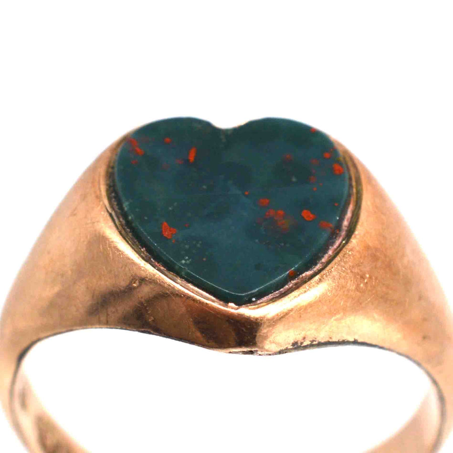 Edwardian 9ct gold signet ring with heart-shaped bloodstone, showcasing unique craftsmanship and romantic design.
