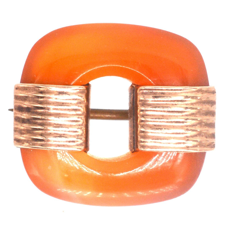 Art Deco 9ct gold carnelian agate brooch featuring a stylish orange design, perfect for any lapel.