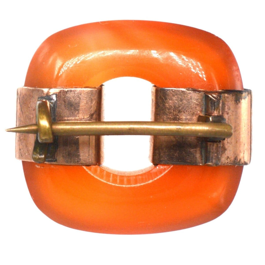 Art Deco 9ct gold brooch with carnelian agate in a unique vintage design, suitable for any lapel.