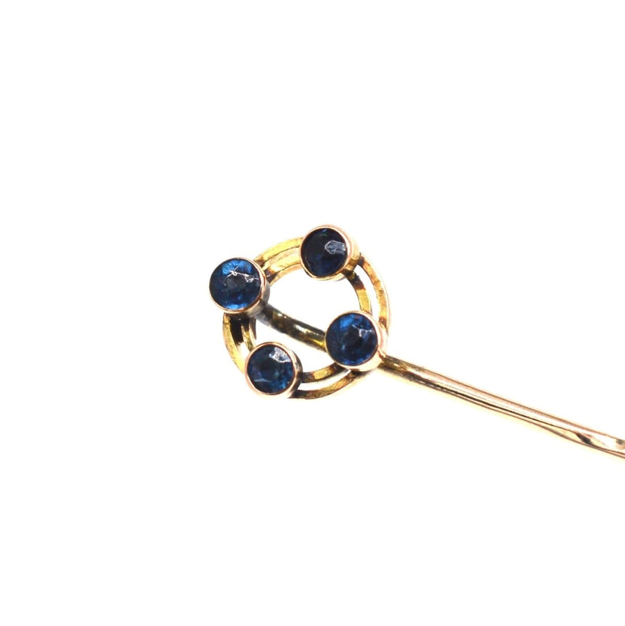 Art Deco 9ct gold tie pin featuring 4 vibrant sapphires in a circular design, hallmark Chester 1924.