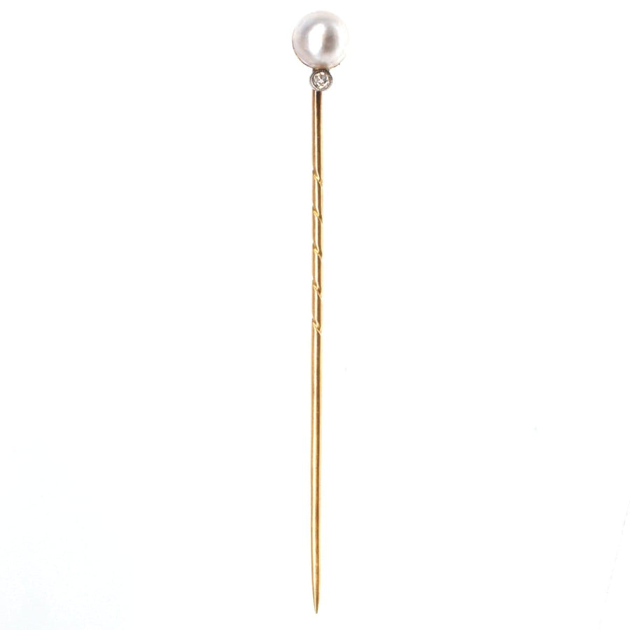 Edwardian 14ct gold tie pin featuring a natural pearl and diamond, perfect for enhancing silk ties.