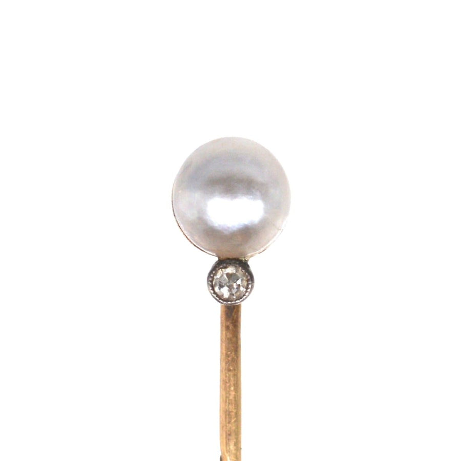Elegant Edwardian 14ct gold stickpin featuring a natural pearl and sparkling diamond, perfect for silk ties.