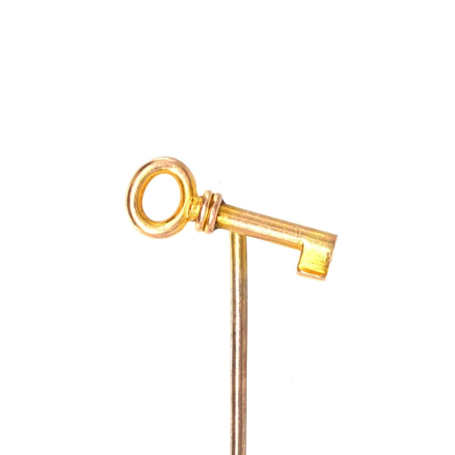 Edwardian 15ct gold key tie pin, symbolizing love and new beginnings, featuring an exquisite key design.