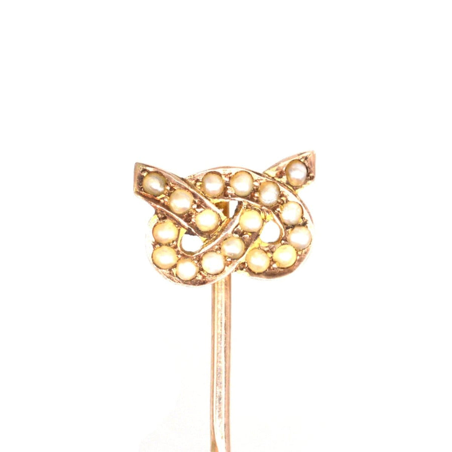 15ct gold Stafford knot tie pin adorned with natural split pearls, an elegant early 1900s accessory.