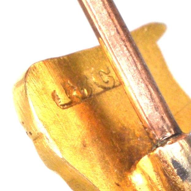 18ct gold Britannia tie pin showing detailed craftsmanship and hallmark engraving.