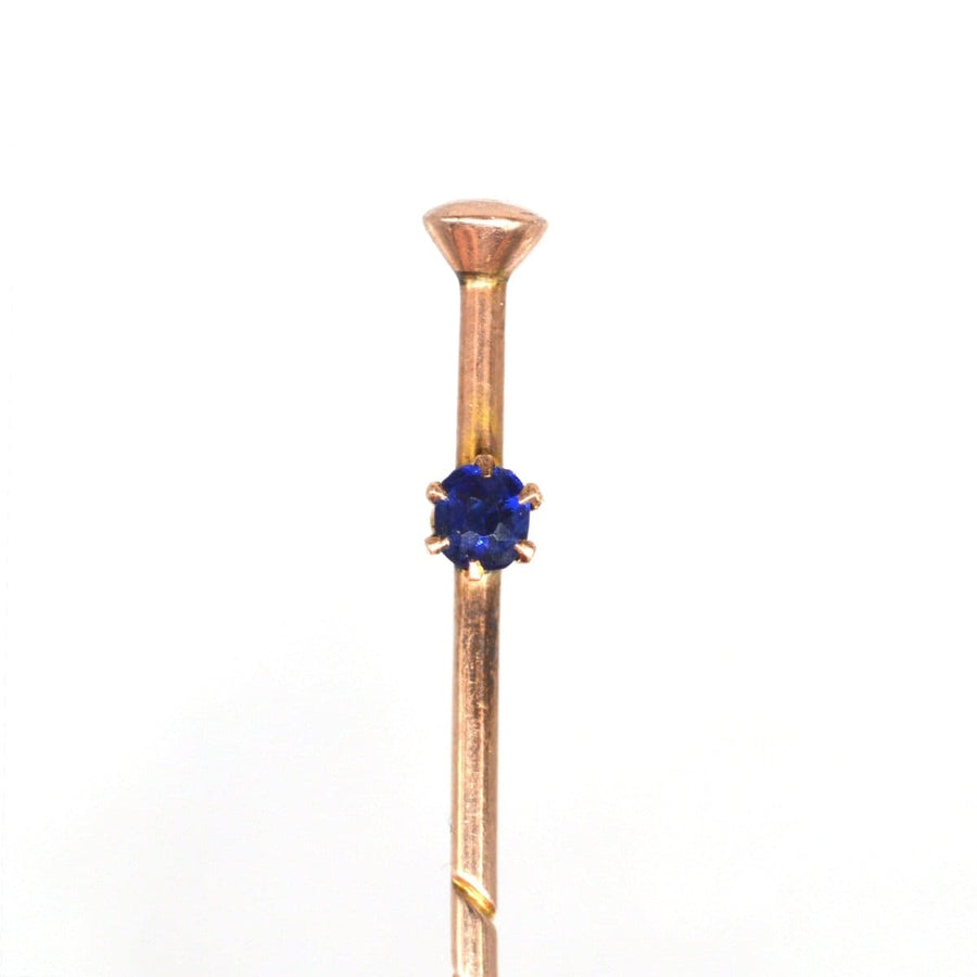 Edwardian 9ct gold tie pin featuring a sapphire, designed as a vintage walking cane accessory.