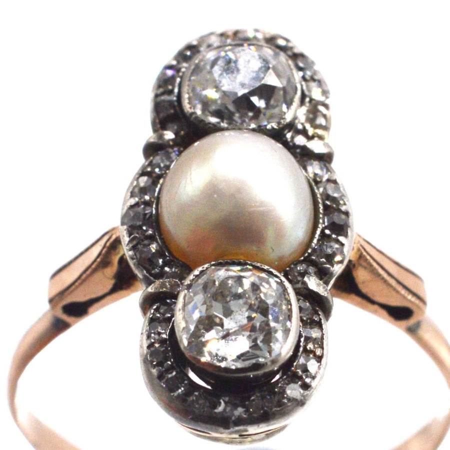 Edwardian three stone ring with old mine cut diamonds and natural pearl, circa 1905, in silver and gold.