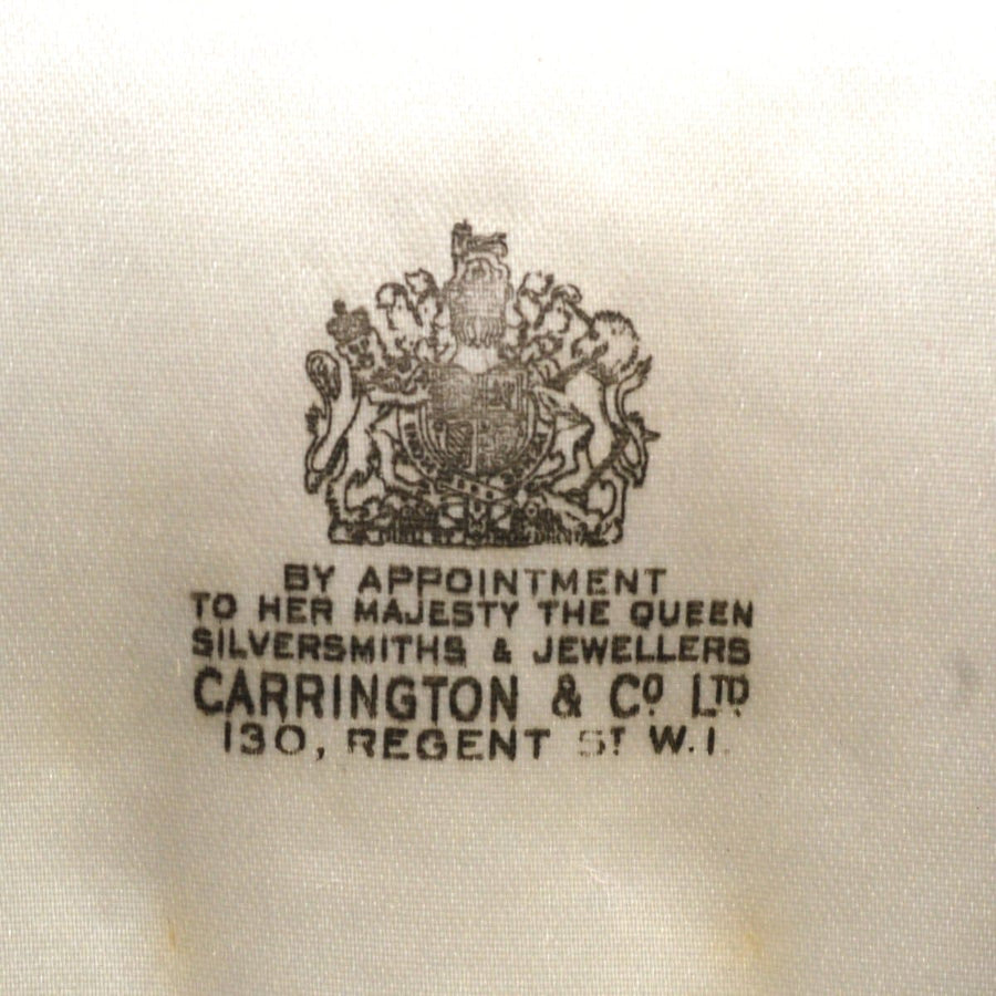 Carrington & Co logo from a vintage jewelry case, showcasing royal appointment to Queen, fine craftsmanship.
