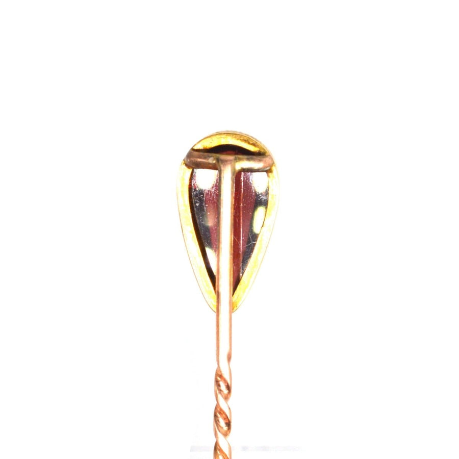 Victorian 9ct gold tie pin with cabochon pear shaped garnet, featuring a secure stopper, made between 1880-1900.