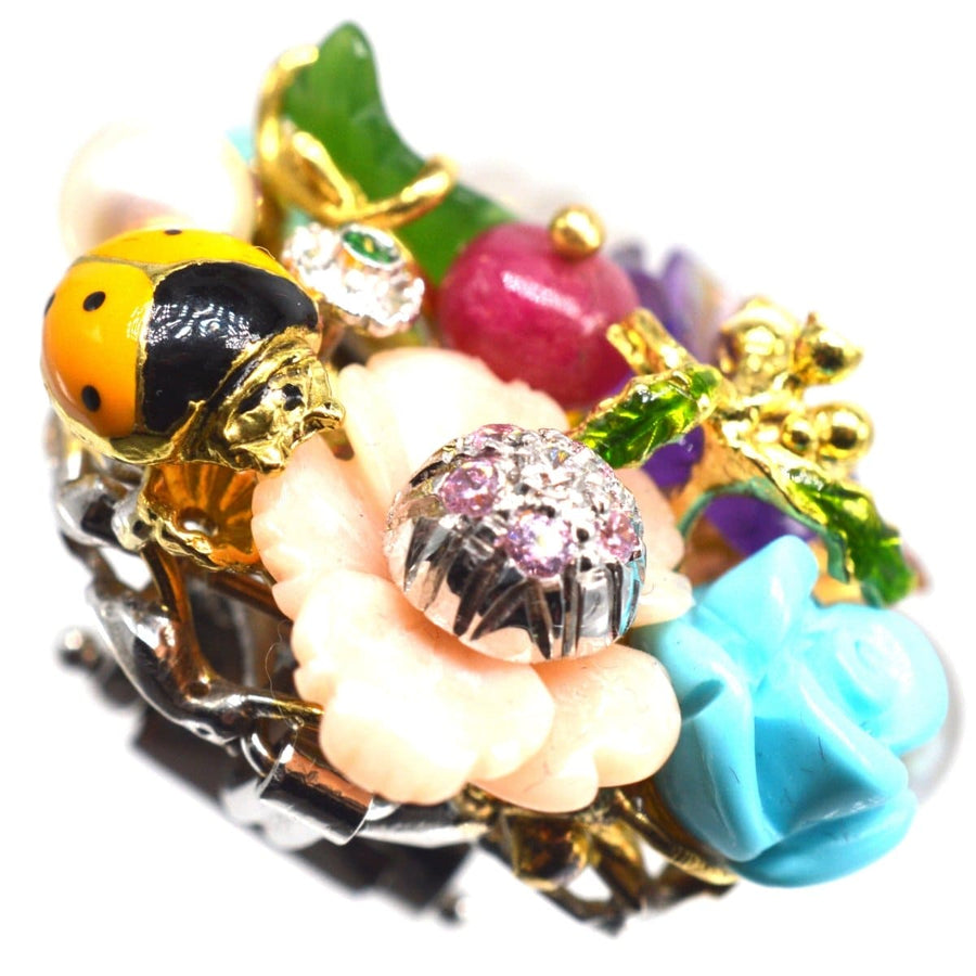 Vintage 18ct white gold brooch with multi-gem flowers, ruby, ladybird, and intricate detailing by Santagostino.
