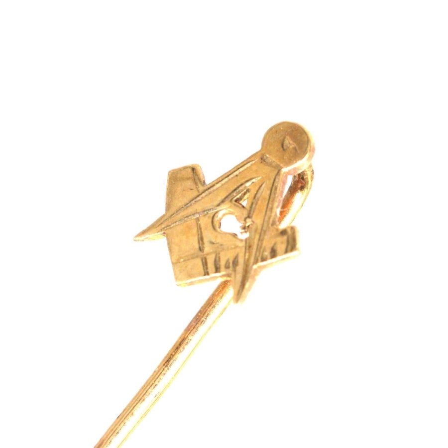 Vintage 9ct gold Masonic tie pin featuring square and compass symbols, representing virtue and wise conduct.