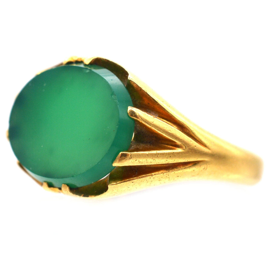 Art Deco 18ct gold signet ring with green chalcedony, featuring unique ridged shoulders and a rich green hue.