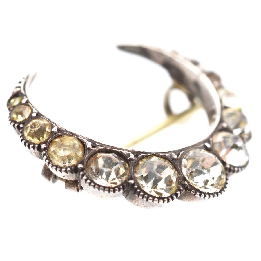 Art Deco silver crescent moon brooch adorned with paste stones, perfect as a wedding gift.