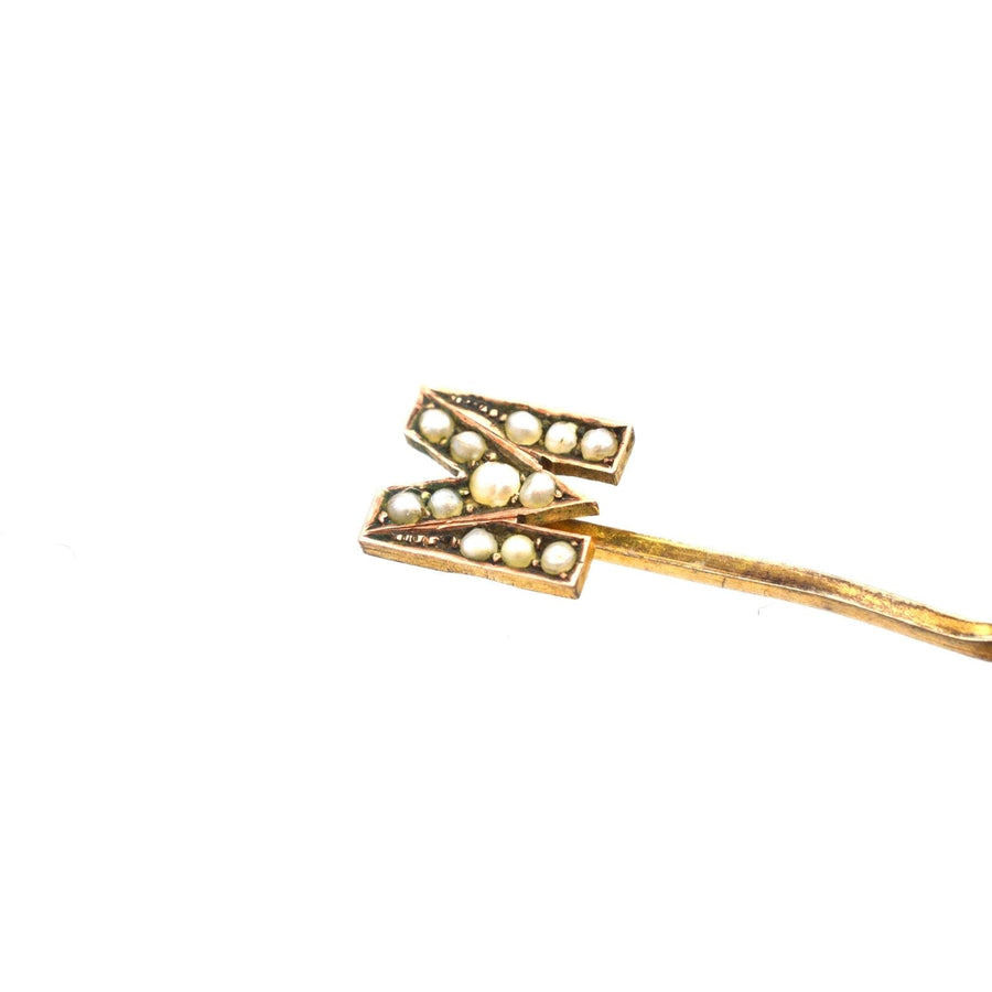 Edwardian 15ct gold tie pin featuring seed pearls in the shape of the letter 'M', ideal for stylish menswear.