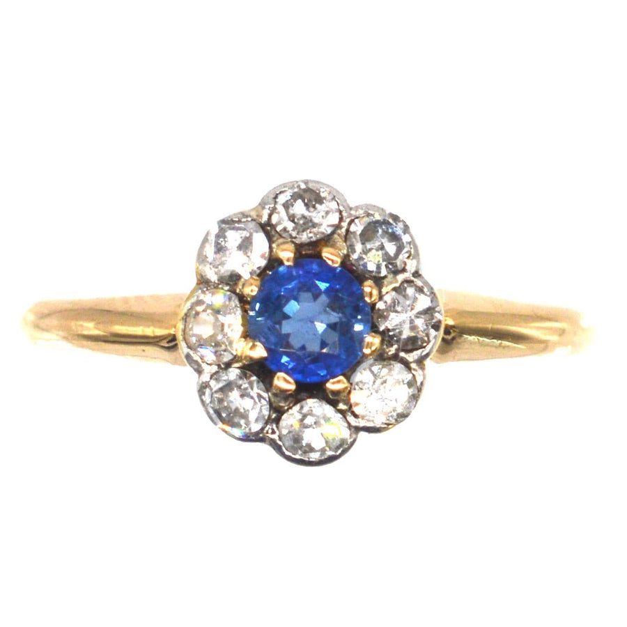 Edwardian 18ct gold and platinum sapphire and diamond cluster ring, showcating a stunning Ceylon blue sapphire.