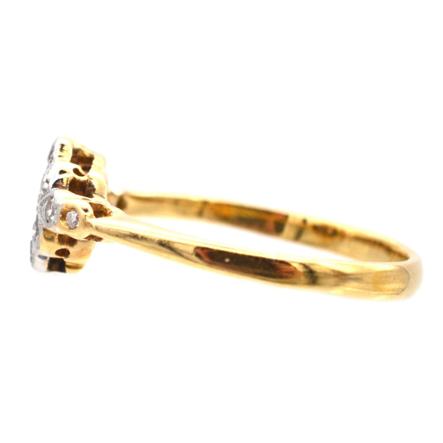 Edwardian 18ct gold and platinum diamond cluster ring side view, featuring 0.20 carats of dazzling diamonds.