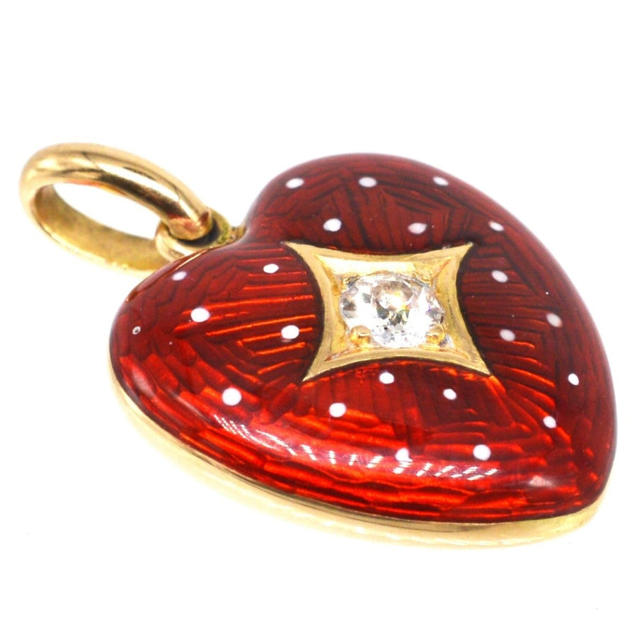 Edwardianisches Herzmedaillon aus 18 Karat Gold mit roter Emaille, weißen Punkten und einem funkelnden Diamanten in goldener Sternfassung.