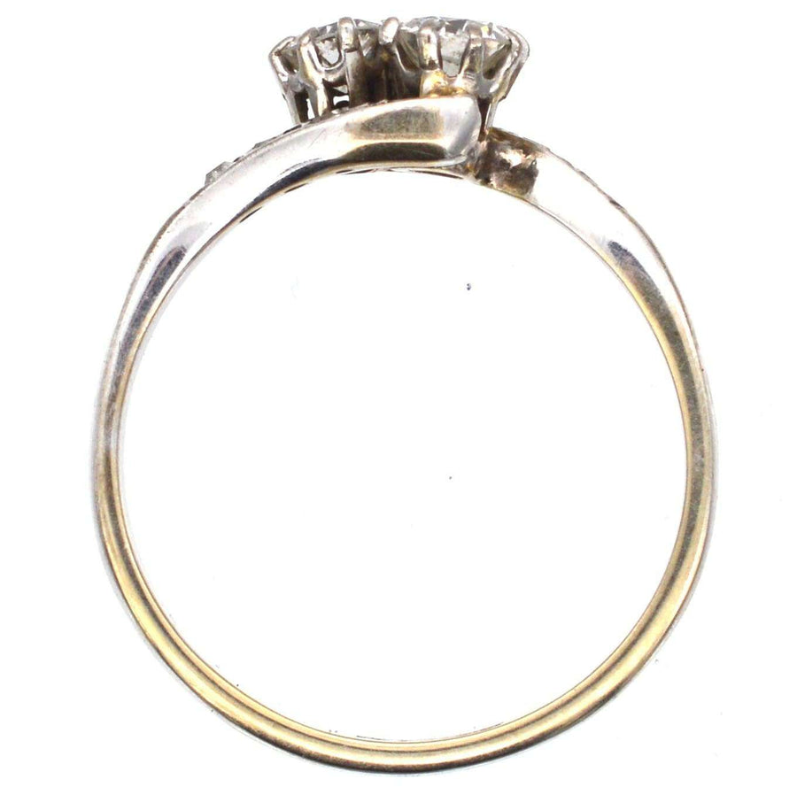 Edwardian 18ct white gold diamond 'Toi et Moi' crossover ring showcating two stones and elegant design.