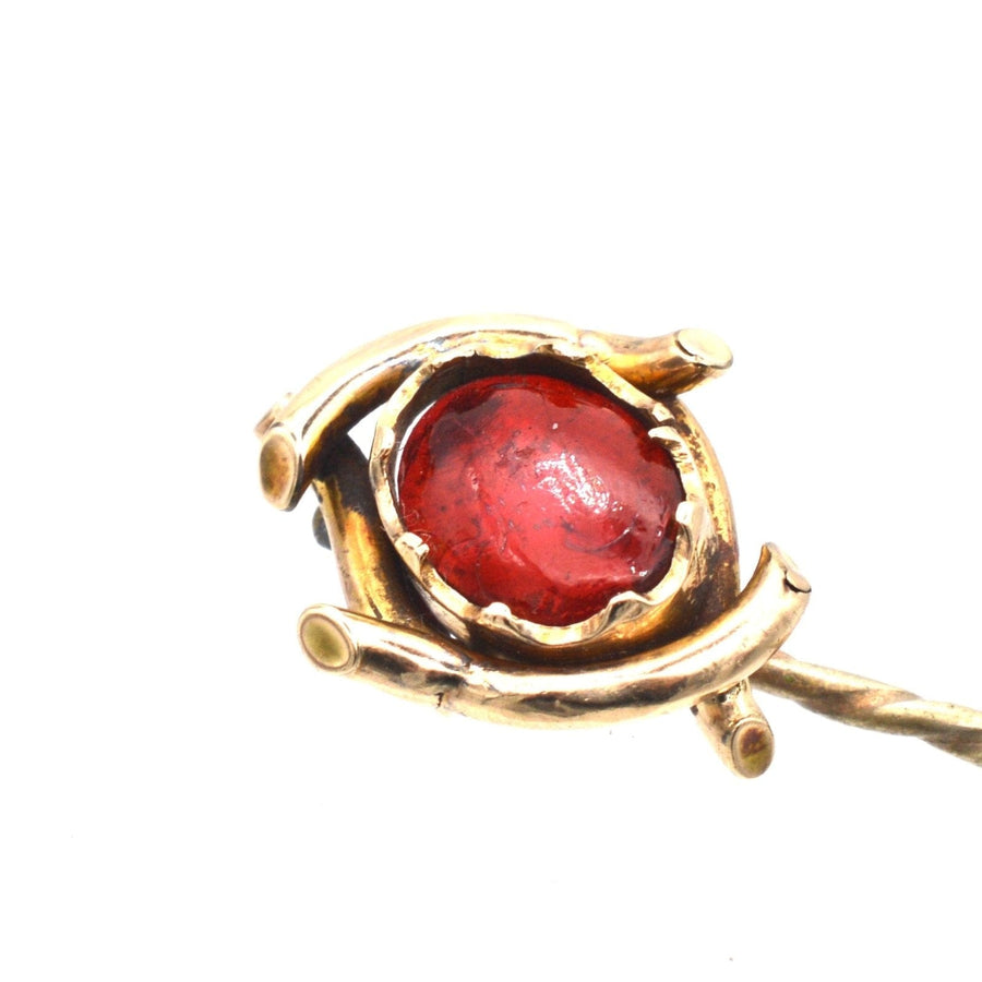 Edwardian 9ct gold tie pin featuring a large red cabochon paste, resembling a garnet, perfect for colorful silk ties.